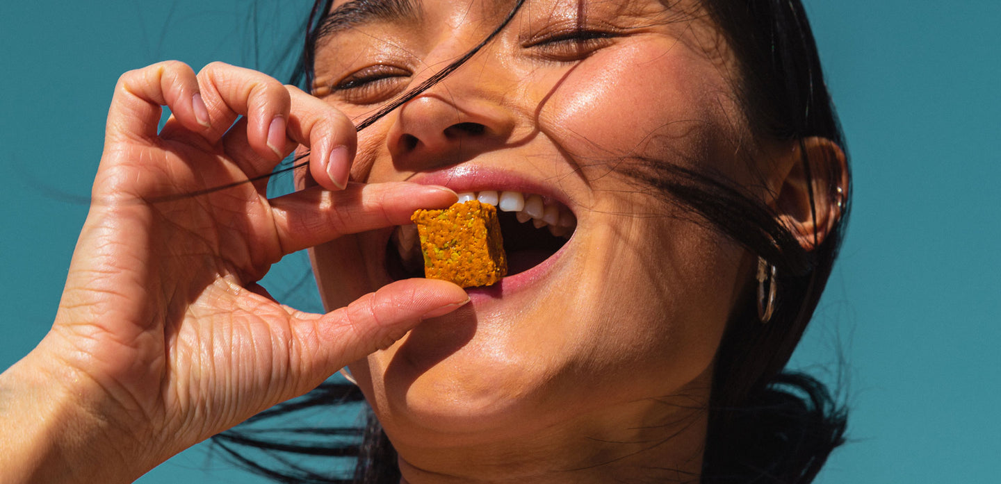 A woman enjoying a GEM Bite.